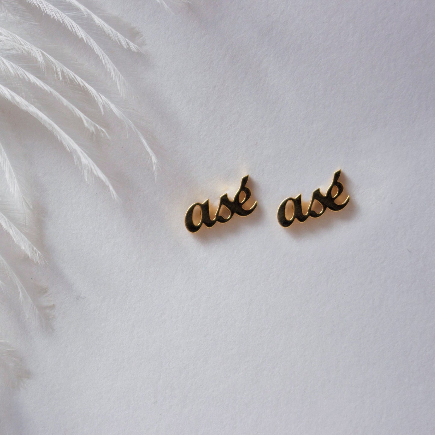 asé earrings